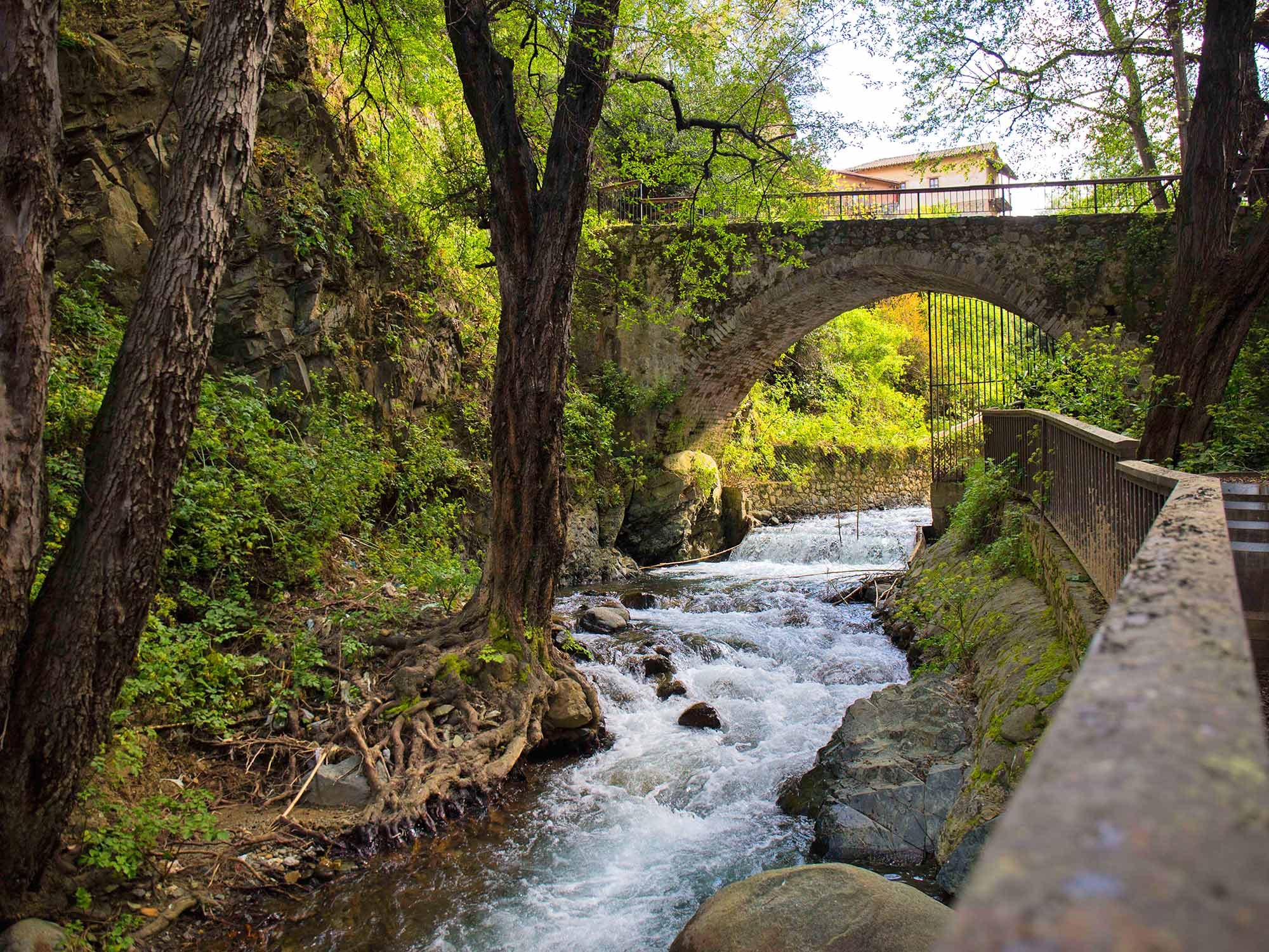 The stone bridge and river beside The Mill Hotel